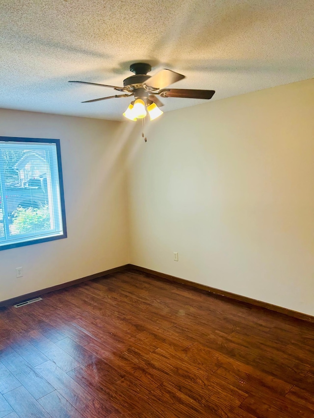 3333 Nevada Ave N Unit 3302, Crystal, MN 55427 - unfurnished room with dark wood-style floors, ceiling fan, a textured ceiling, and baseboards