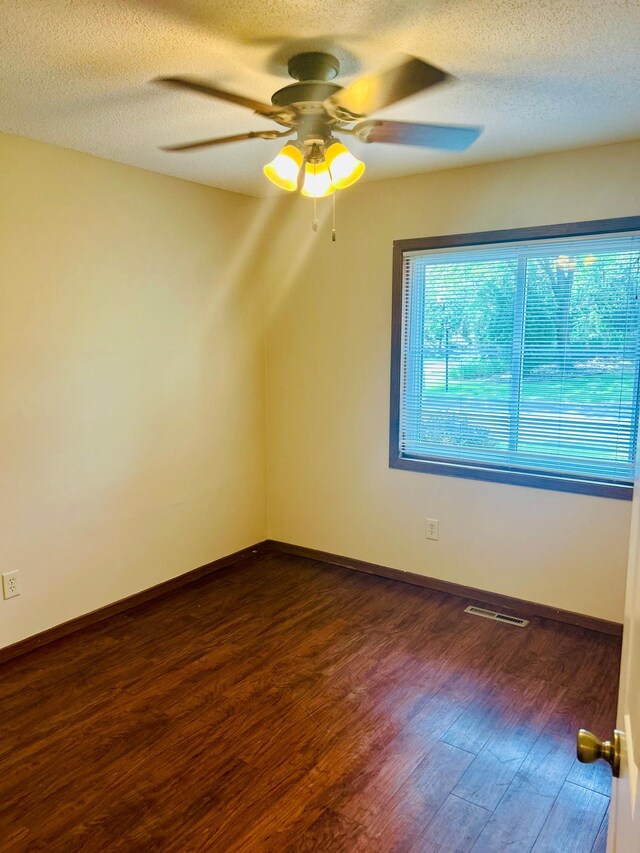 3333 Nevada Ave N Unit 3302, Crystal, MN 55427 - bonus room with dark wood-style flooring, a ceiling fan, a textured ceiling, and baseboards