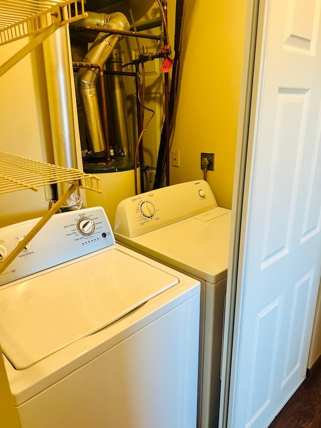 3333 Nevada Ave N Unit 3302, Crystal, MN 55427 - washroom with washing machine and clothes dryer and dark wood-style floors