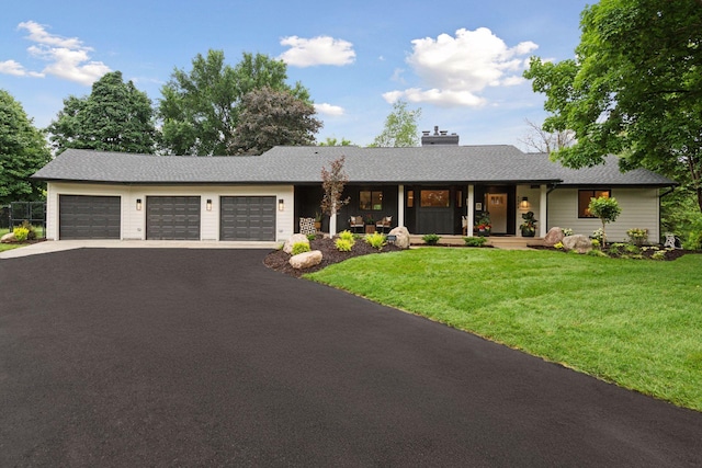 2324 Rivendell Ln, Minnetonka, MN 55305 - ranch-style home featuring asphalt driveway, an attached garage, a front lawn, and a porch