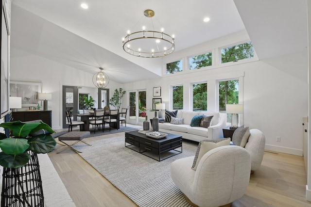 2324 Rivendell Ln, Minnetonka, MN 55305 - living area with a chandelier, light wood finished floors, a towering ceiling, and recessed lighting