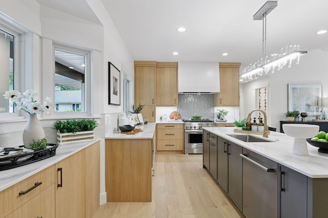 2324 Rivendell Ln, Minnetonka, MN 55305 - kitchen featuring appliances with stainless steel finishes, custom range hood, light wood-type flooring, decorative backsplash, and light stone counters