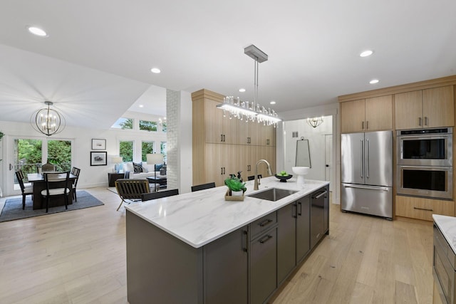 2324 Rivendell Ln, Minnetonka, MN 55305 - kitchen featuring appliances with stainless steel finishes, a chandelier, recessed lighting, and light wood-type flooring