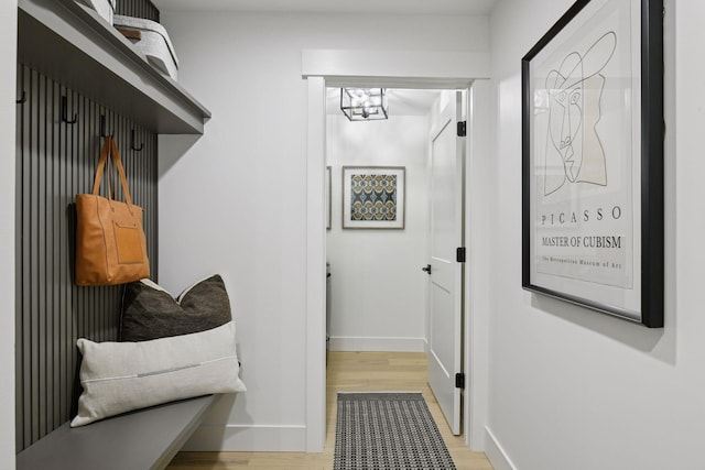 2324 Rivendell Ln, Minnetonka, MN 55305 - mudroom featuring a chandelier and wood finished floors