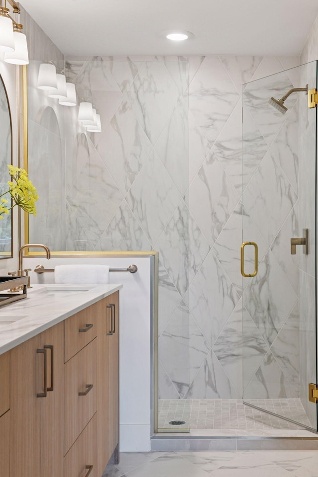 2324 Rivendell Ln, Minnetonka, MN 55305 - bathroom with vanity, marble look tiles, a marble finish shower, and recessed lighting