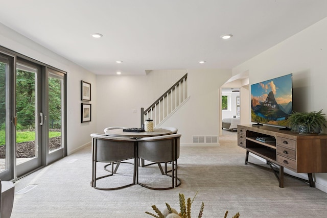 2324 Rivendell Ln, Minnetonka, MN 55305 - living area with light colored carpet, stairway, recessed lighting, and arched walkways