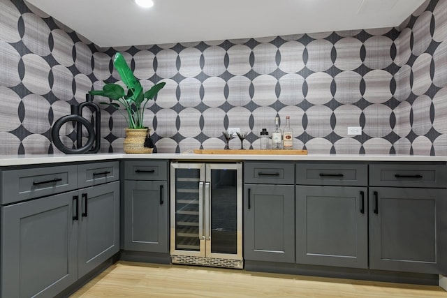 2324 Rivendell Ln, Minnetonka, MN 55305 - indoor dry bar featuring wine cooler, light wood-style flooring, decorative backsplash, and recessed lighting