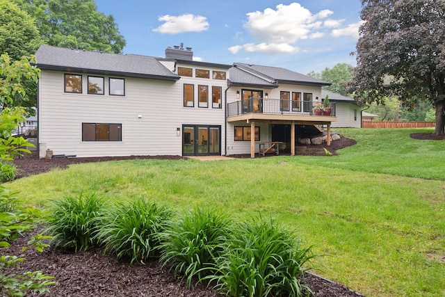 2324 Rivendell Ln, Minnetonka, MN 55305 - back of house with french doors, a wooden deck, a yard, a chimney, and a shingled roof