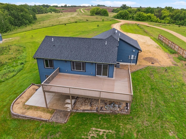 26884 709th St, Lake City, MN 55041 - back of house with a wooden deck, a shingled roof, and a yard
