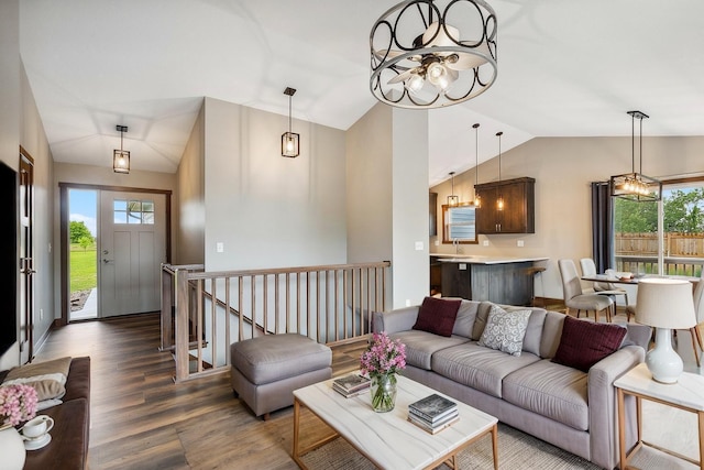 26884 709th St, Lake City, MN 55041 - living area featuring lofted ceiling, a chandelier, wood finished floors, and healthy amount of natural light