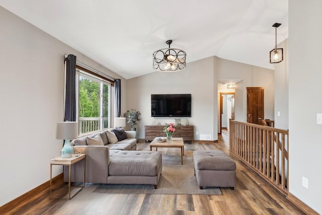 26884 709th St, Lake City, MN 55041 - living area with wood finished floors, lofted ceiling, and a chandelier