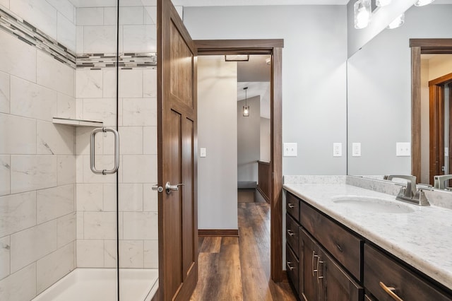 26884 709th St, Lake City, MN 55041 - bathroom with vanity, wood finished floors, and a stall shower