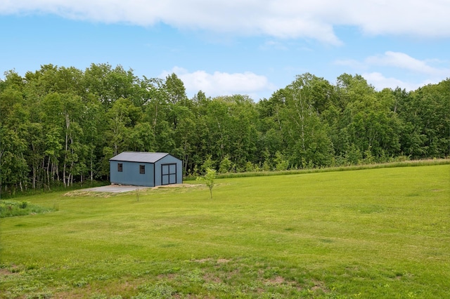 26884 709th St, Lake City, MN 55041 - view of grassy yard featuring an outdoor structure and a wooded view