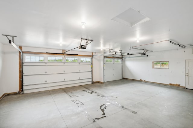 26884 709th St, Lake City, MN 55041 - garage featuring a garage door opener and baseboards