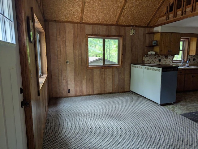 24863 Norway Pine Pl, Ross Lake Twp, MN 56447 - kitchen with wood walls, a sink, brown cabinetry, open shelves, and vaulted ceiling