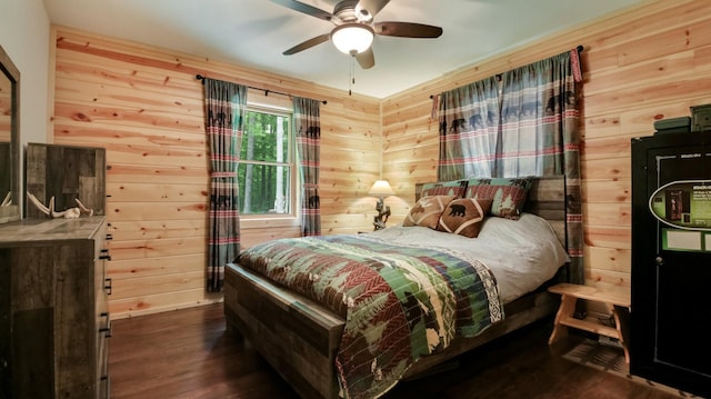 W8567 County Road Mm, Mead Twp, WI 54437 - bedroom with wood walls, dark wood-style floors, and a ceiling fan