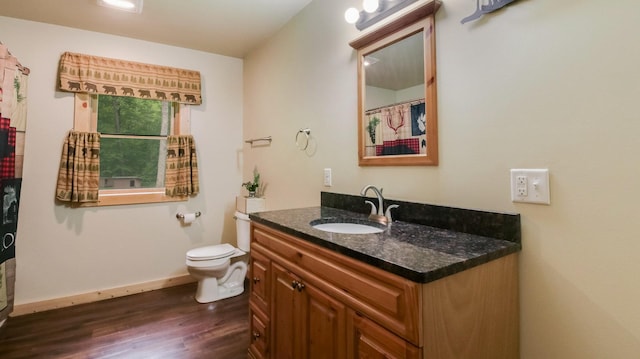 W8567 County Road Mm, Mead Twp, WI 54437 - full bath with vanity, wood finished floors, toilet, and baseboards