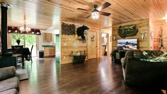 W8567 County Road Mm, Mead Twp, WI 54437 - living room with wood walls, a chandelier, ceiling fan, wooden ceiling, and dark wood finished floors