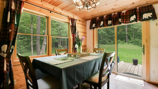 W8567 County Road Mm, Mead Twp, WI 54437 - dining area featuring a chandelier, wood ceiling, wood finished floors, and wood walls