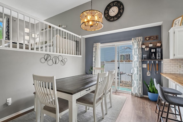 903 6th Ave NW, Buffalo, MN 55313 - dining area featuring a chandelier and wood finished floors