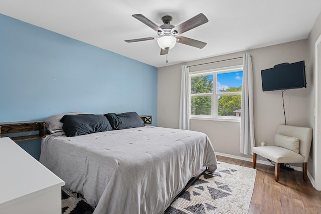 903 6th Ave NW, Buffalo, MN 55313 - bedroom featuring light wood finished floors and ceiling fan