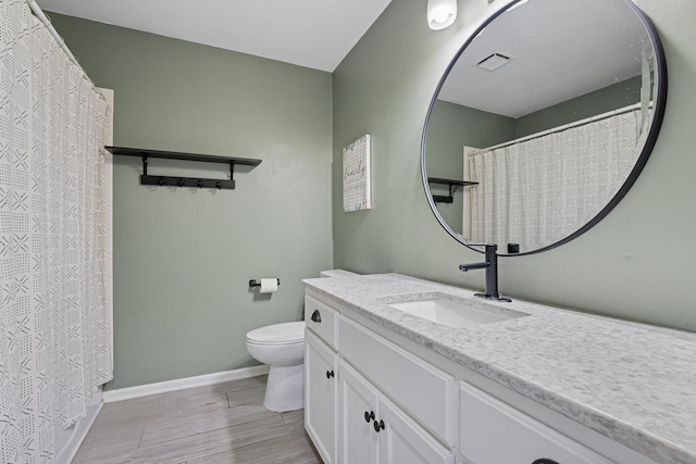 903 6th Ave NW, Buffalo, MN 55313 - bathroom featuring vanity and wood finished floors
