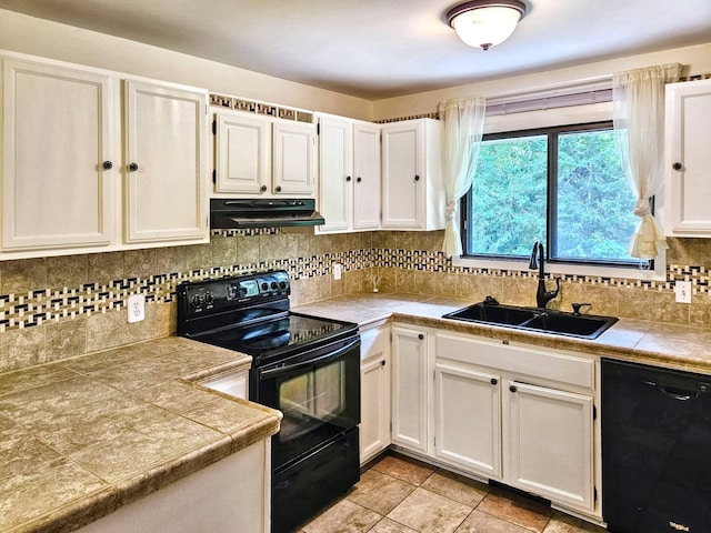 7635 Wedgewood Ct N, Maple Grove, MN 55311 - kitchen featuring black appliances, under cabinet range hood, a sink, white cabinets, and decorative backsplash