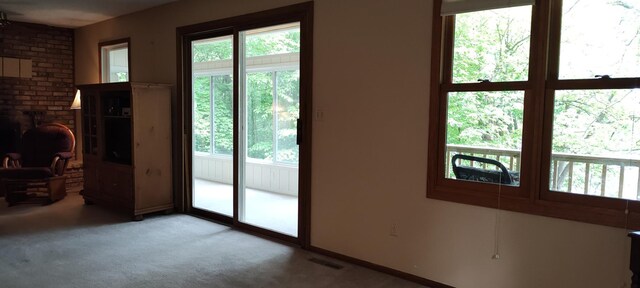 12183 Crooked Lake Ln SW, Moe Twp, MN 56327 - doorway to outside with carpet and a fireplace