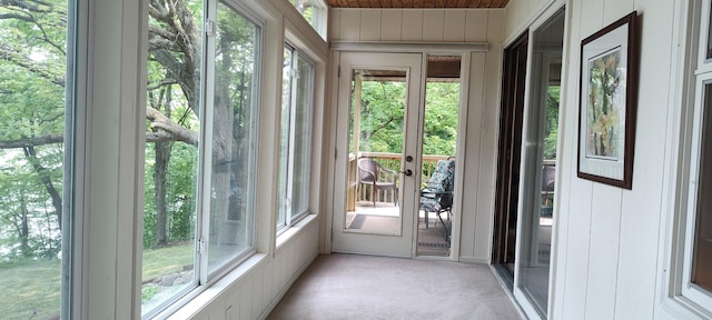 12183 Crooked Lake Ln SW, Moe Twp, MN 56327 - unfurnished sunroom featuring carpet flooring, wooden walls, and wooden ceiling