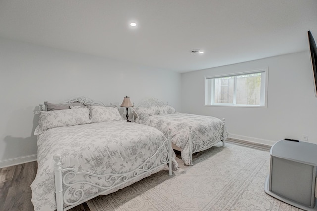 1345 Bluff Border Rd, New Richmond, WI 54017 - bedroom featuring wood finished floors, baseboards, and recessed lighting