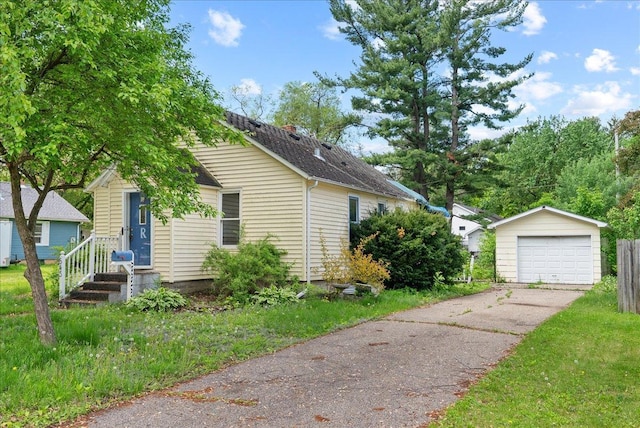 543 Pearl St, River Falls, WI 54022 - view of front of home with an outbuilding, a garage, and driveway