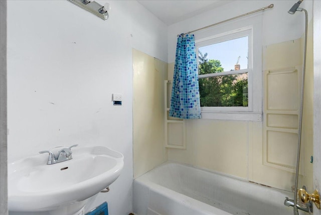 543 Pearl St, River Falls, WI 54022 - bathroom featuring a sink and bathing tub / shower combination