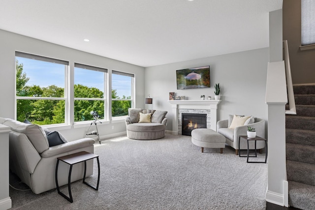 3751 Crane Island Ct, Minnetrista, MN 55331 - living area with stairway, carpet flooring, a glass covered fireplace, baseboards, and recessed lighting