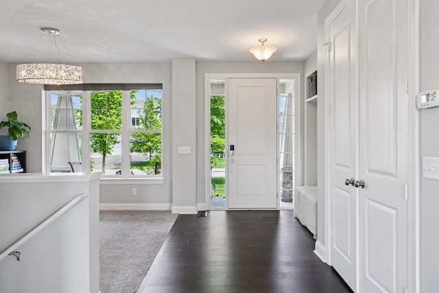 3751 Crane Island Ct, Minnetrista, MN 55331 - foyer entrance with baseboards, a chandelier, and dark wood-style floors