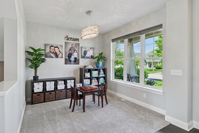 3751 Crane Island Ct, Minnetrista, MN 55331 - home office with a chandelier, baseboards, and carpet floors