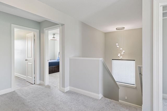 3751 Crane Island Ct, Minnetrista, MN 55331 - hallway featuring an upstairs landing, carpet, and baseboards