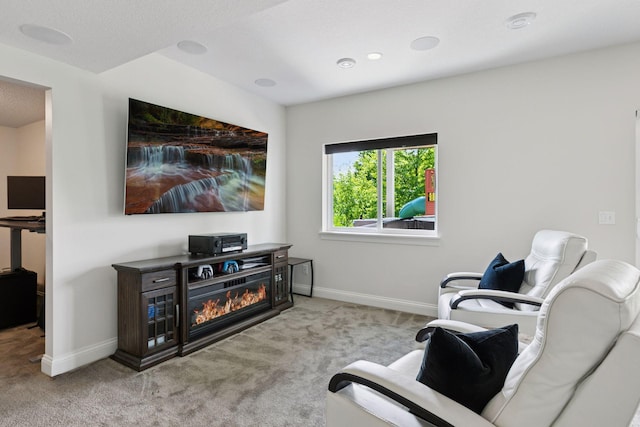 3751 Crane Island Ct, Minnetrista, MN 55331 - living area with carpet floors, baseboards, and a glass covered fireplace