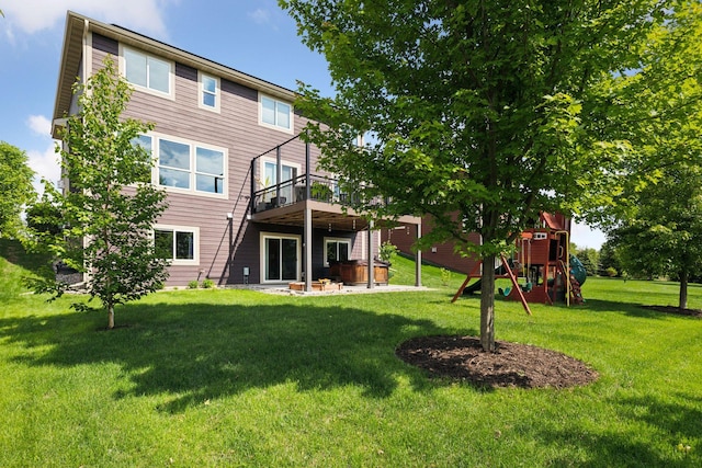 3751 Crane Island Ct, Minnetrista, MN 55331 - rear view of property featuring a playground, a covered hot tub, and a yard