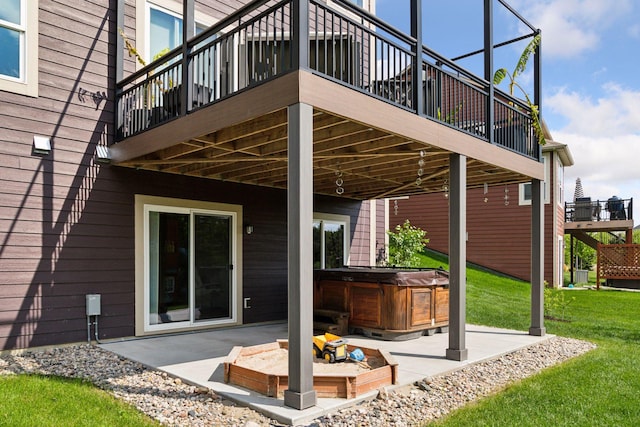 3751 Crane Island Ct, Minnetrista, MN 55331 - rear view of property with a hot tub, a patio, a yard, and a deck