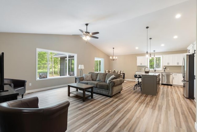 TBD Lynndale Dr, Baxter, MN 56401 - living room featuring light wood-type flooring, plenty of natural light, baseboards, a ceiling fan, and lofted ceiling