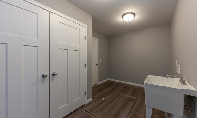 TBD Lynndale Dr, Baxter, MN 56401 - washroom featuring dark wood-style floors, baseboards, and a textured ceiling