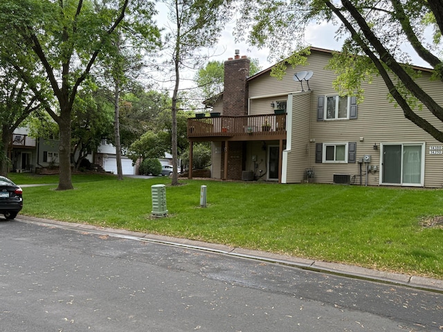 14410 92nd Ave N, Maple Grove, MN 55369 - exterior space with a chimney, a front lawn, central AC, and a wooden deck