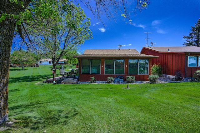 3865 Wahtomin Trl NW, Alexandria, MN 56308 - rear view of property featuring a lawn and a patio area