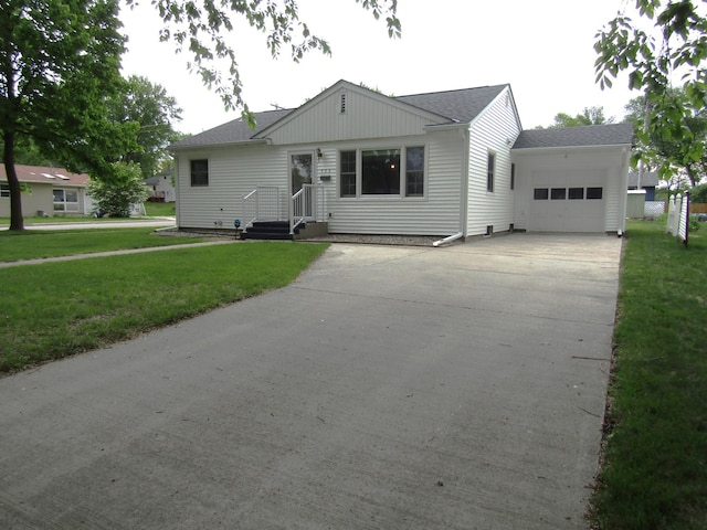 302 12th St, Montevideo, MN 56265 - single story home with a garage, driveway, a front lawn, and a shingled roof