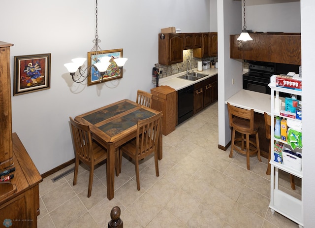 1427 23rd St S, Fargo, ND 58103 - dining space with a chandelier and baseboards
