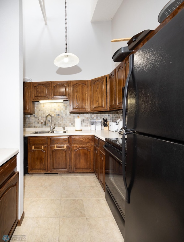 1427 23rd St S, Fargo, ND 58103 - kitchen featuring black appliances, a sink, tasteful backsplash, light countertops, and a high ceiling