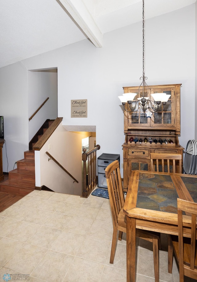 1427 23rd St S, Fargo, ND 58103 - dining area with a chandelier, beamed ceiling, and light tile patterned floors