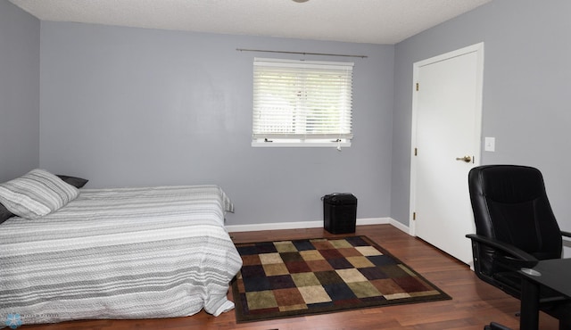 1427 23rd St S, Fargo, ND 58103 - bedroom with wood finished floors, an office area, and baseboards