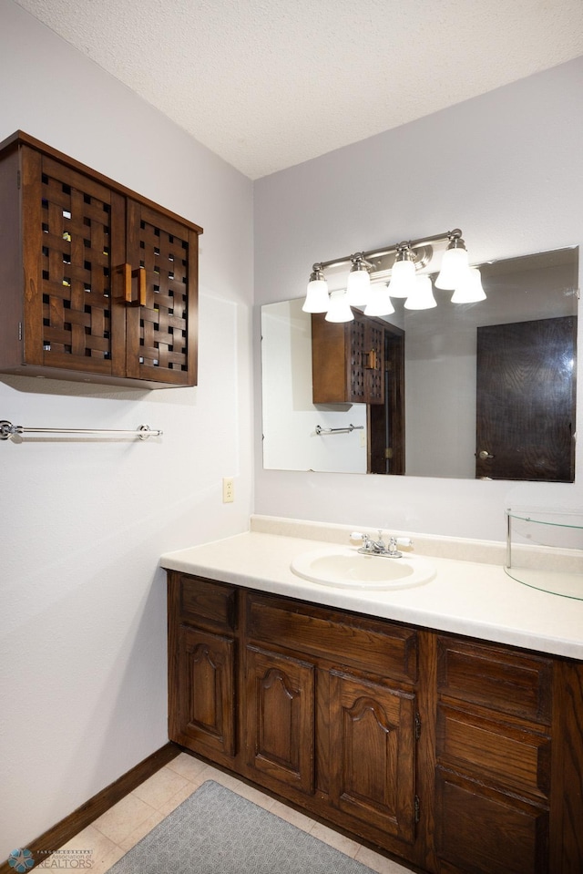 1427 23rd St S, Fargo, ND 58103 - bathroom featuring vanity, tile patterned floors, and baseboards
