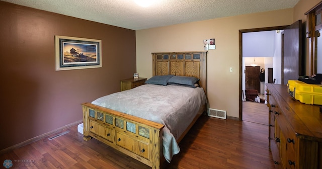 1427 23rd St S, Fargo, ND 58103 - bedroom featuring wood finished floors, a textured ceiling, and baseboards